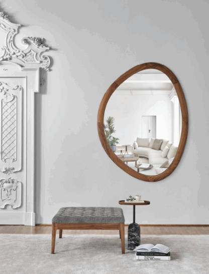 Ronde designspiegel Giolo van Porada met houten frame en organische vormen